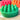 Green shampoo bar with raised bumps on a textured surface, red and orange shampoo bars in the background