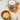 Cedarwood bath salt in a jar with wooden scoop on a marble surface