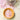 Lavender bath salts in a jar and a small bowl on a white surface